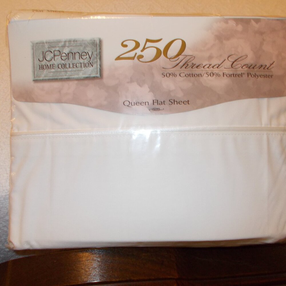 New in package J C Penney queen white flat sheet, 250 thread count